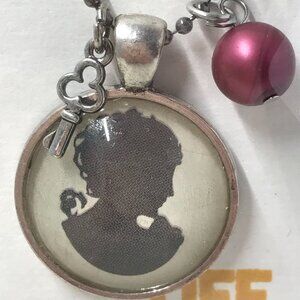 NEW Pendent necklace with key and pink bead. 18" gray metal chain